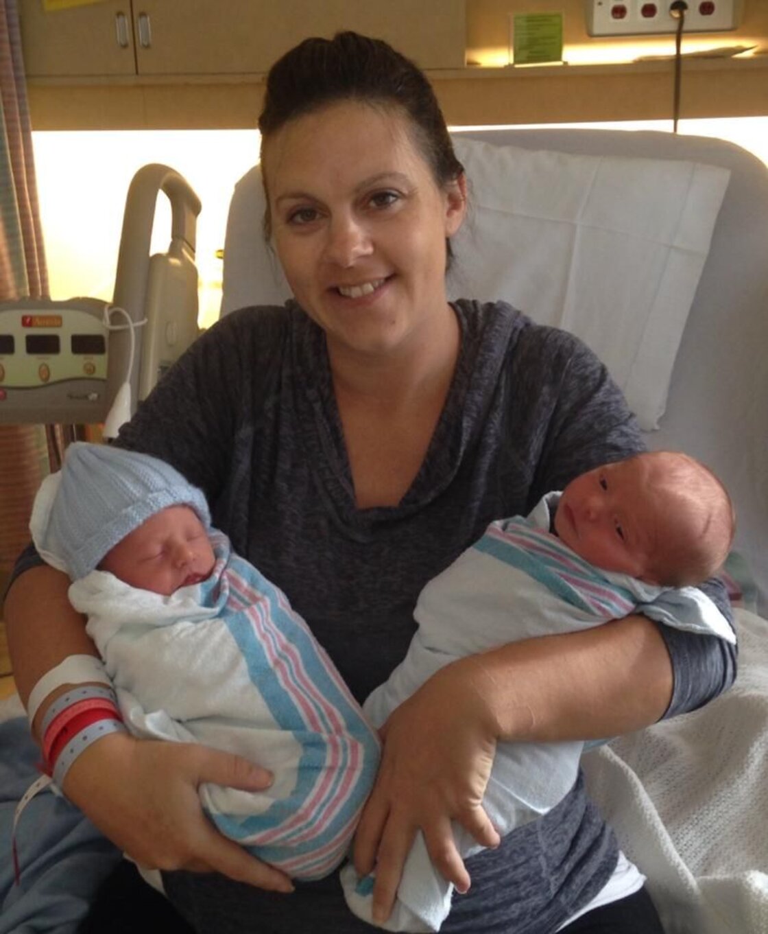 New Zealand surrogate mother with twin babies